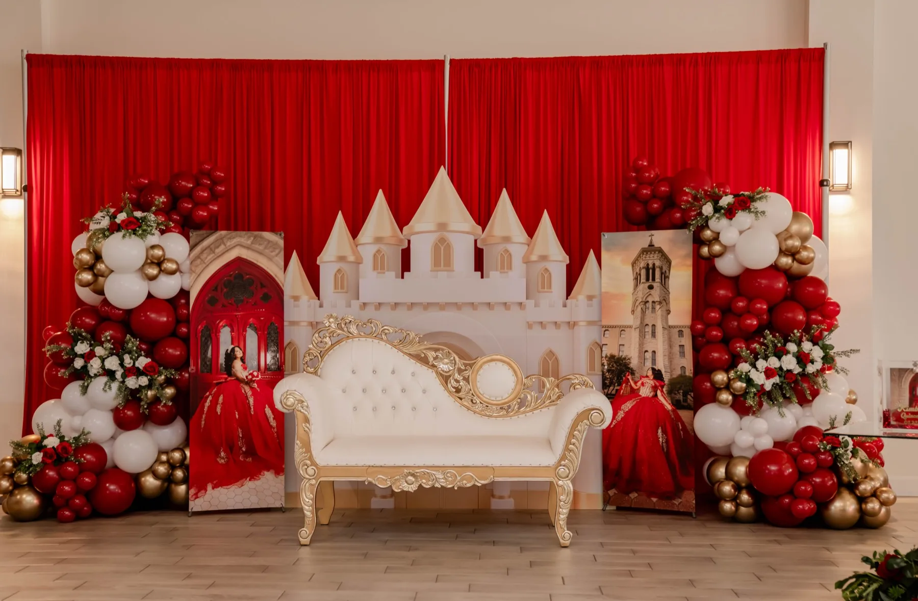 Red and gold quinceanera castle backdrop with floral balloon decor