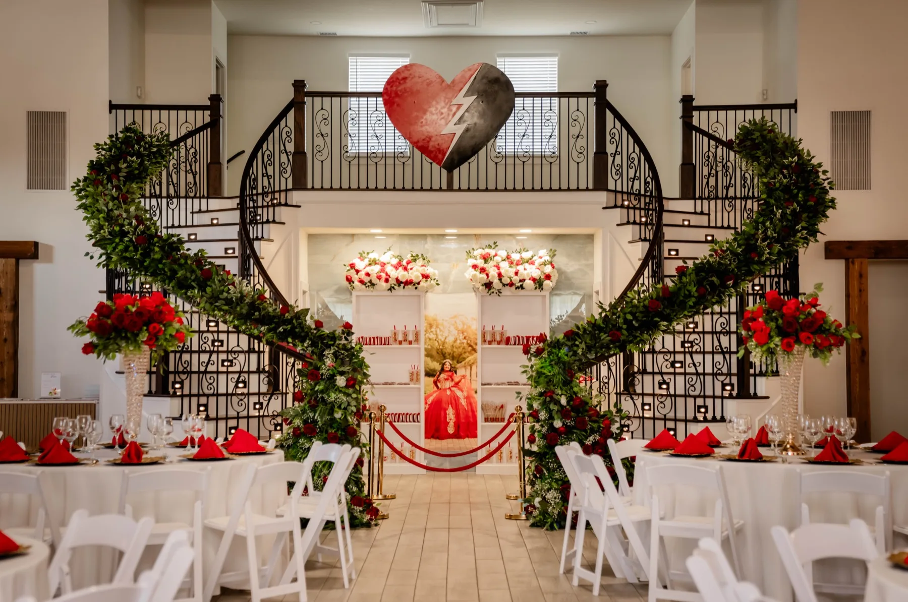Quinceanera grand staircase setup with red roses and heart decor